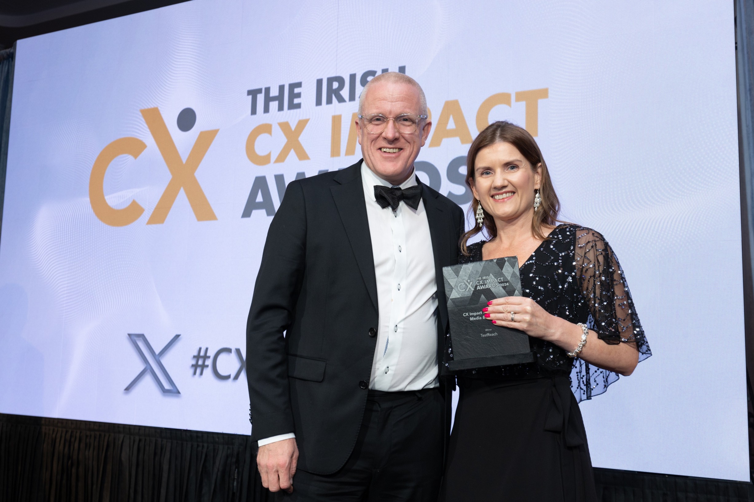 Picture showing Amy Noonan, VP of Operations and Customer Experience, TestReach, accepting award at the Irish Customer Experience Impact Awards